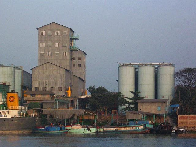 Cement factories line the banks of the Shitalakhya River